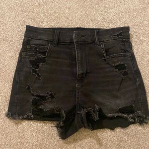 Black distressed jean shorts.